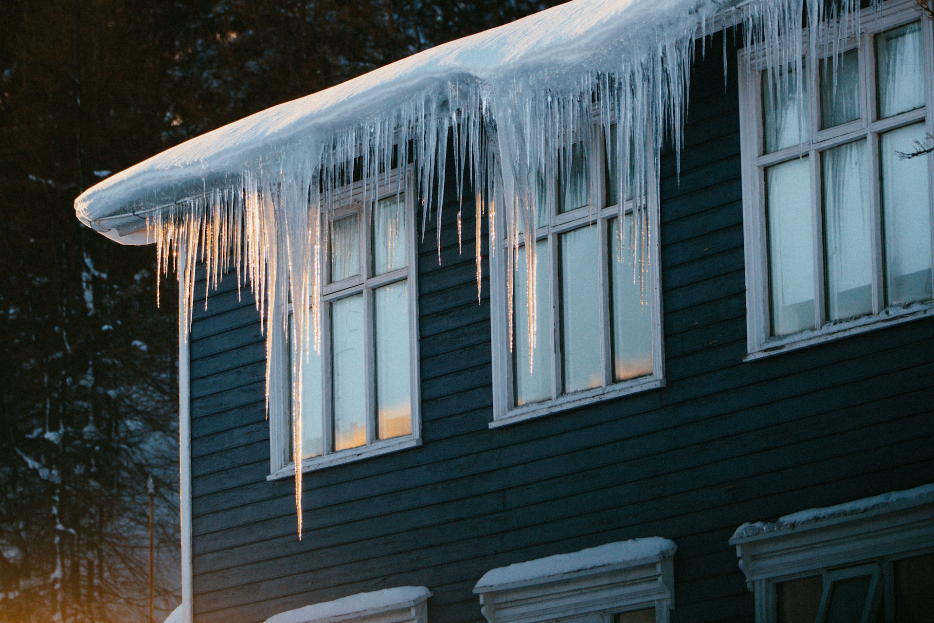 house with large icicles coming off of the roof