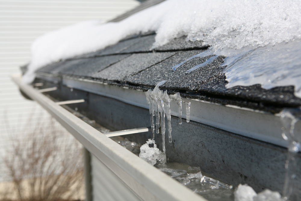 roof and gutters covered in ice and snow